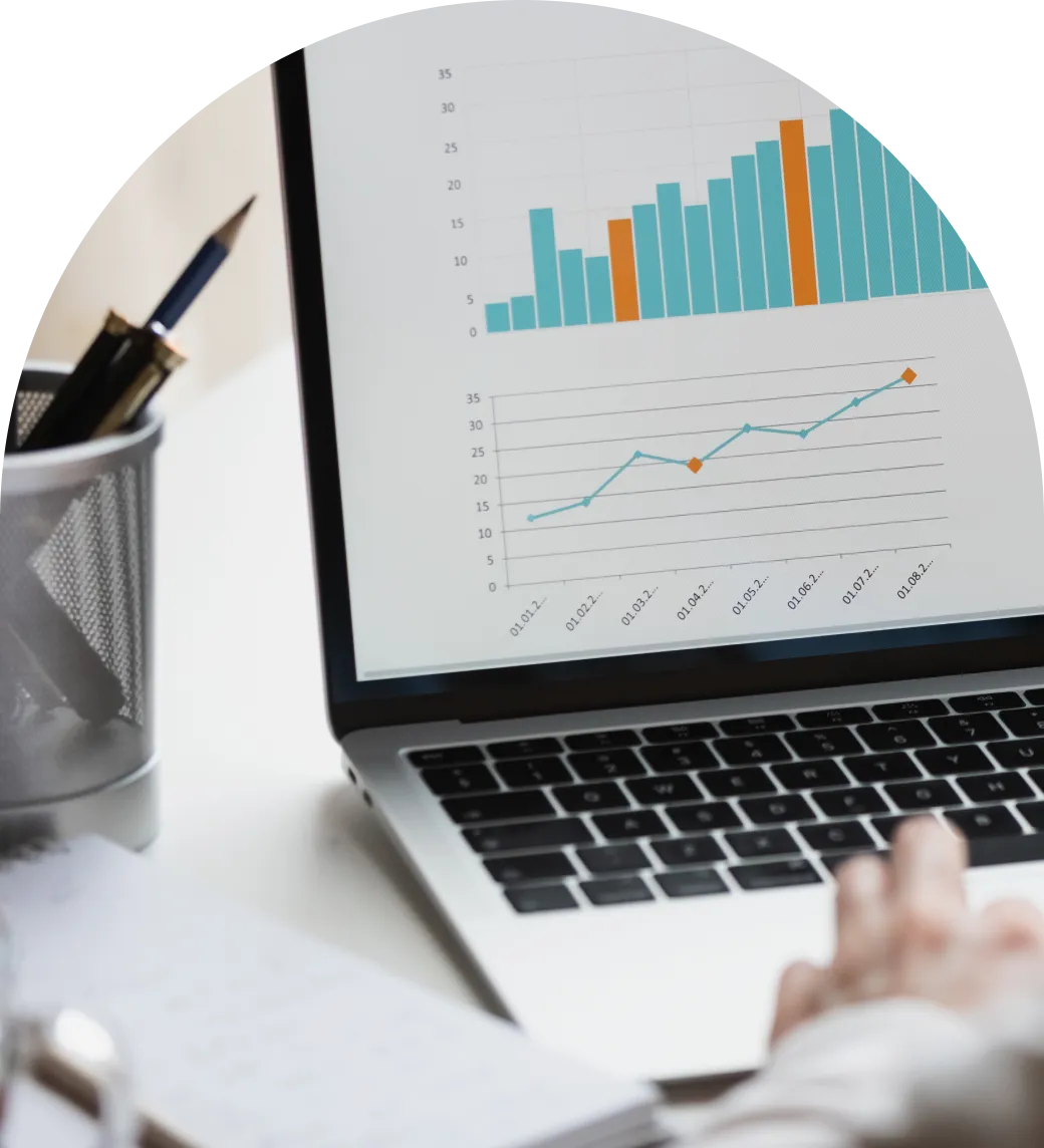 obscured photo of a graph presented on a laptop